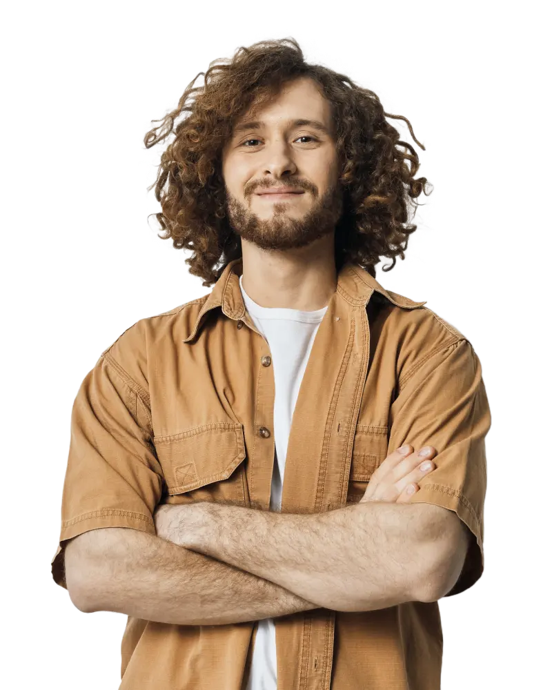 smiling young man with curly hair wearing a casual shirt